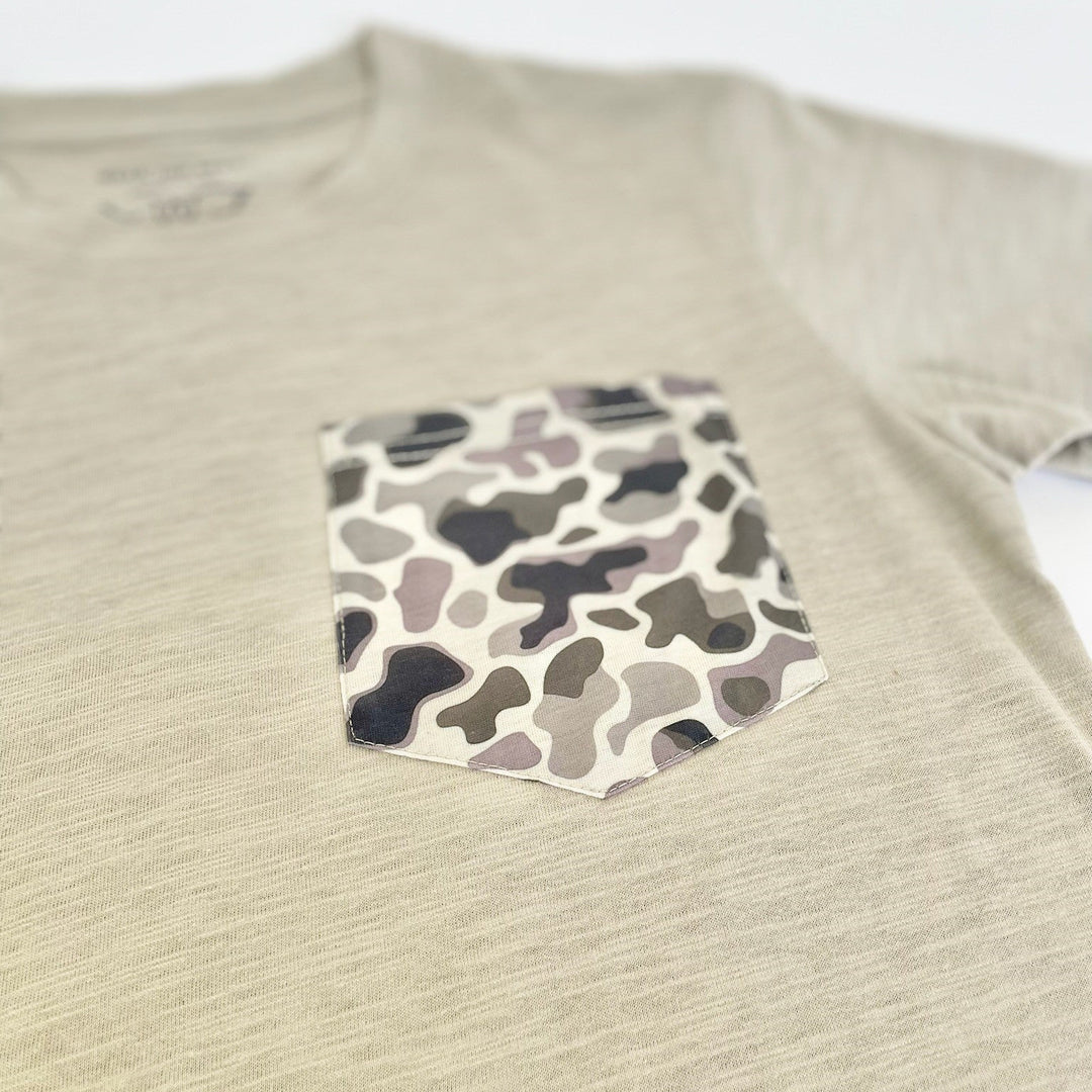 Beige shirt with a camouflage pocket on a white background