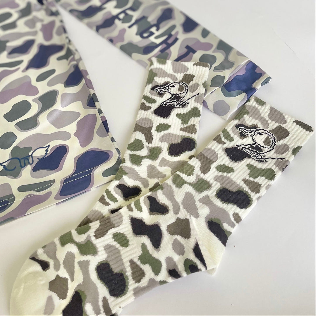 camo socks with duck logo on white background