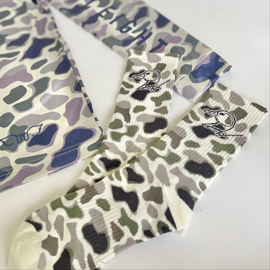 camo socks with duck logo on white background