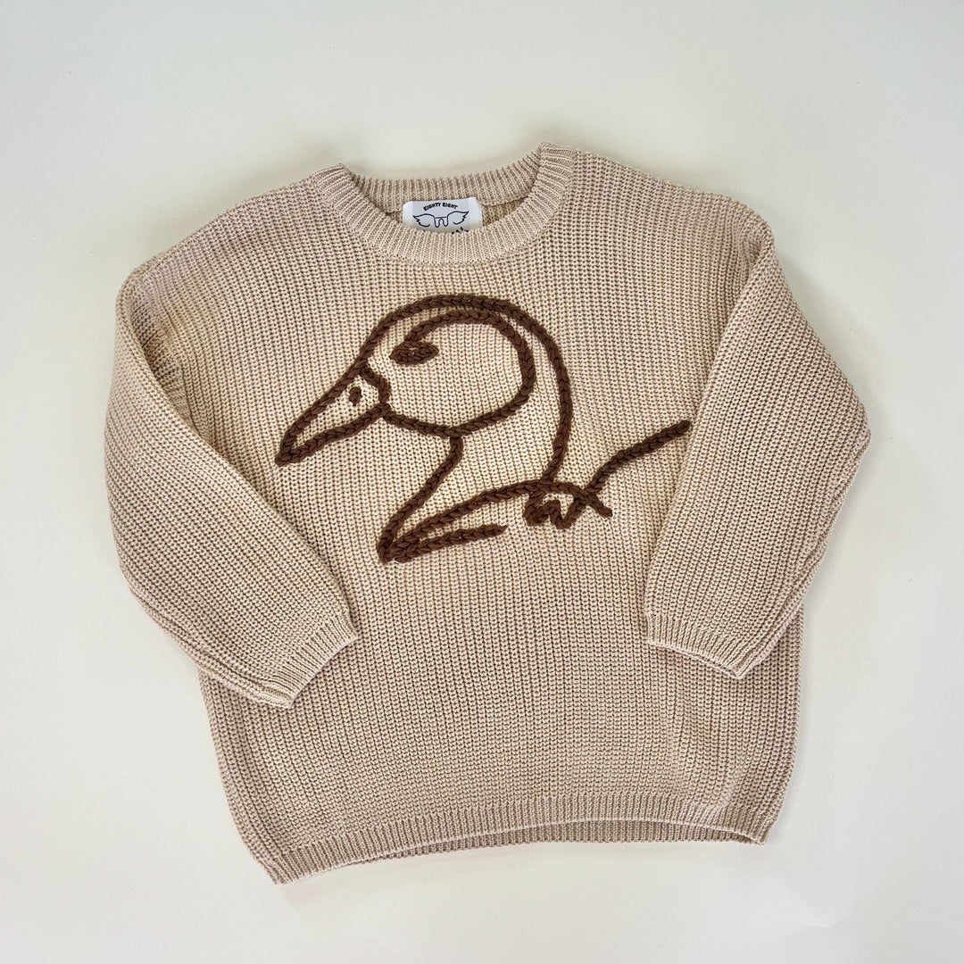 brown duck logo crocheted on khaki crochet sweater on white background