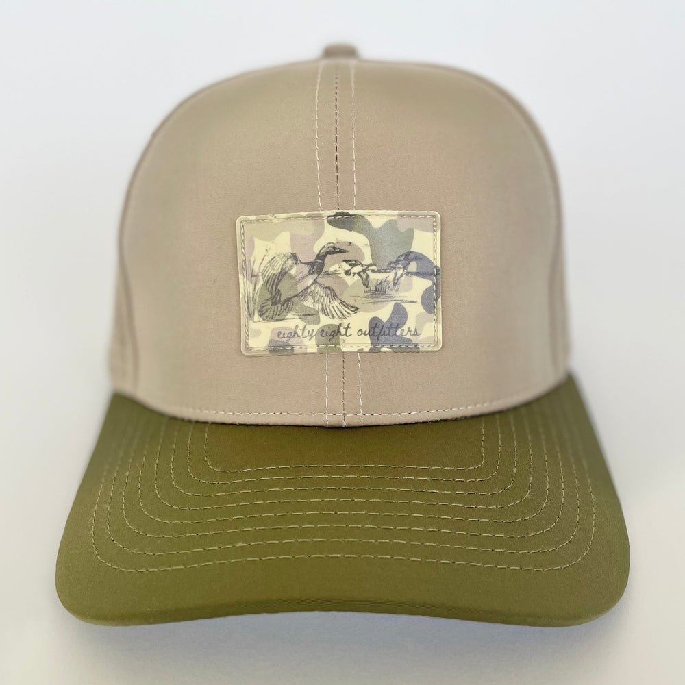 Two-tone cap with a patch on a white background