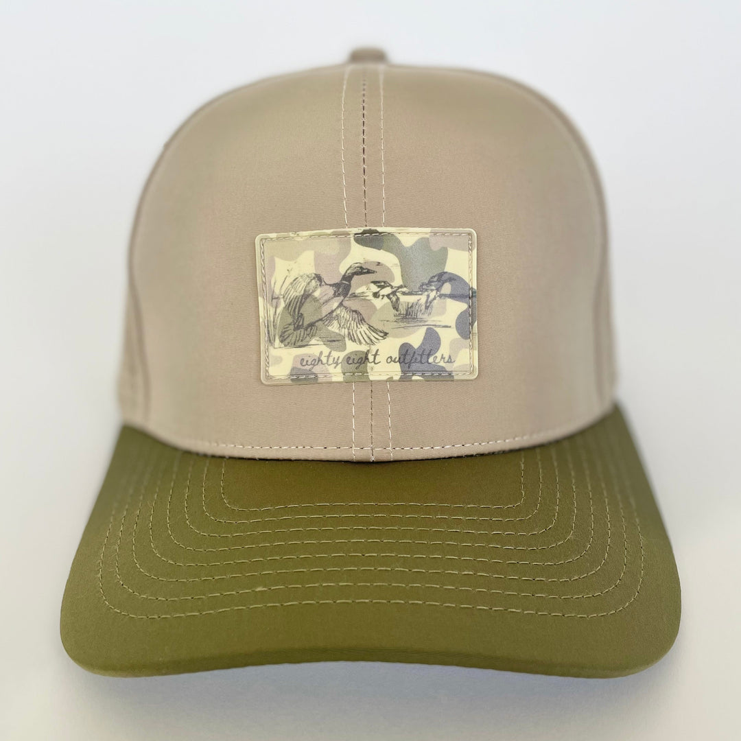 Two-tone cap with a patch on a white background