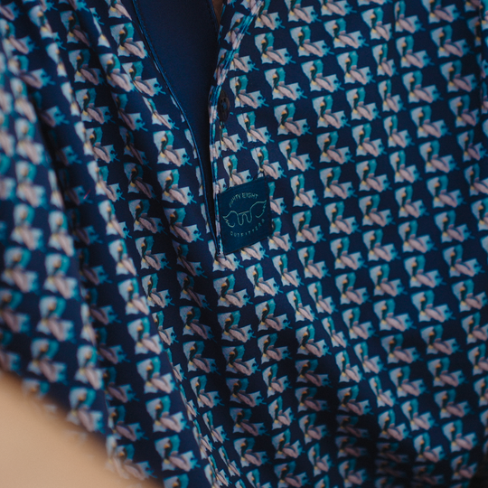Navy blue fabric with a subtle pattern and a brand logo on a beige background