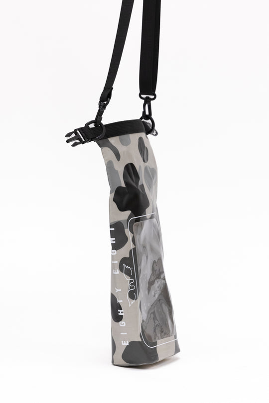 Gray camouflage-patterned firearm sleeve with black strap on a white background
