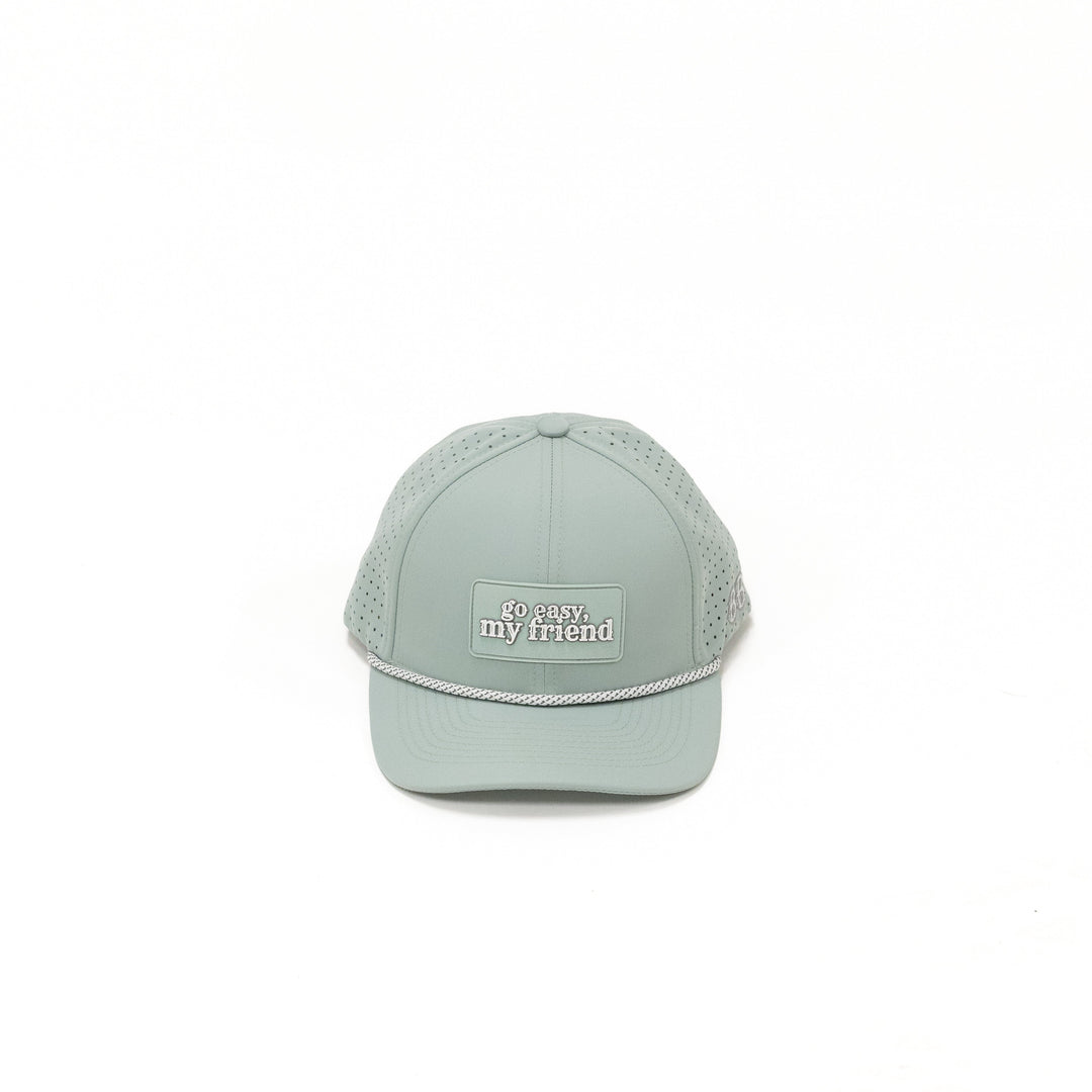 Light green baseball cap with text on a white background
