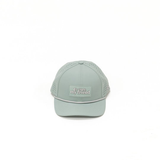 Light green baseball cap with text on a white background