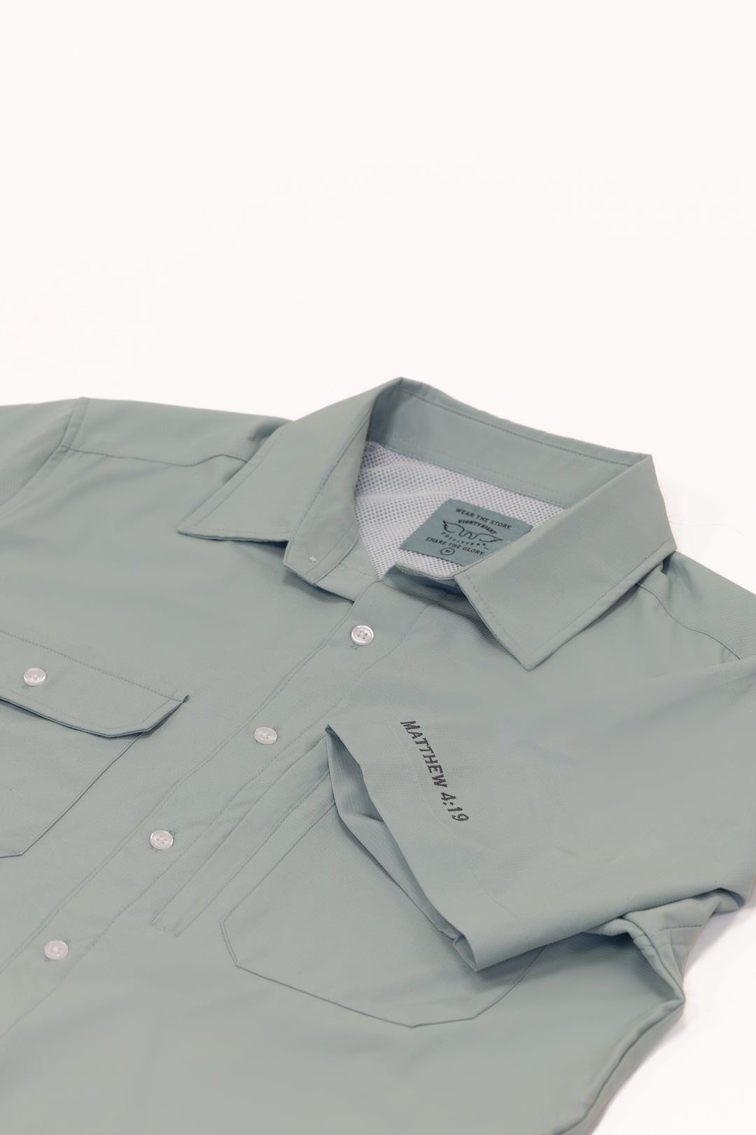 Light gray button-up shirt with collar and pocket on a white background